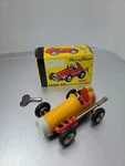 Schuco Wind Up 1042 Micro Racer With Box And Key. Fixed Price $49.00.