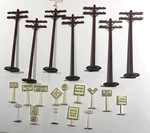 7 Vintage Plastic Model Railroad Telephone Poles & 14 Assorted Signs. Fixed Price $7.00.