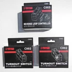 Rokuhan Z-gauge C002 Turnout Switches (2) & C003 Reverse Loop Controller, Nib's. Fixed Price $59.00.